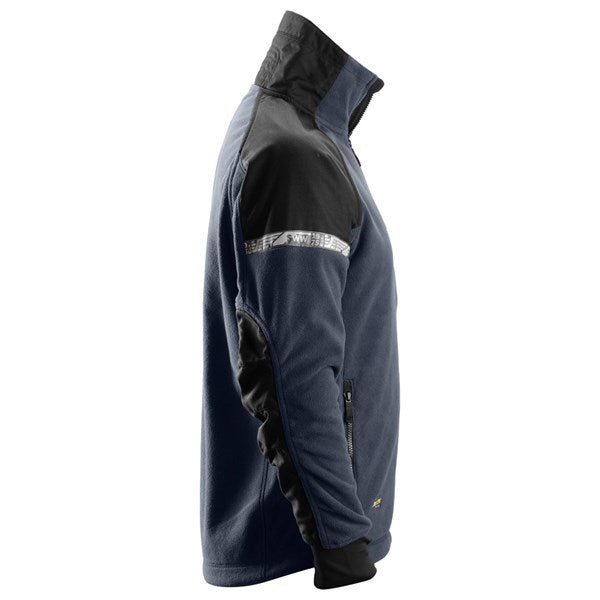 Versatile fleece jacket with pre-bent sleeves and breathable fabric.