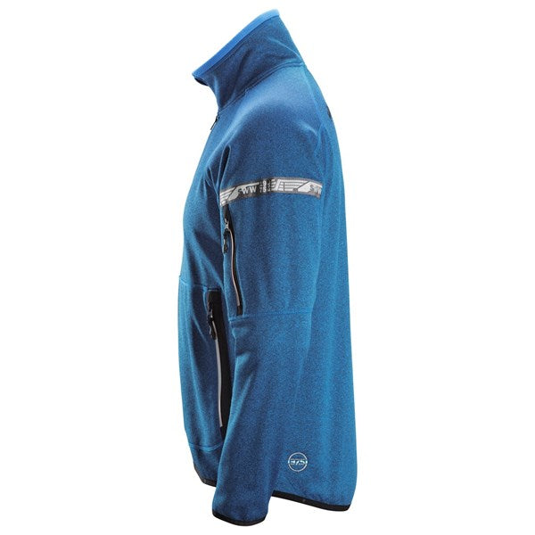 Zipped pockets on versatile fleece jacket for secure storage.